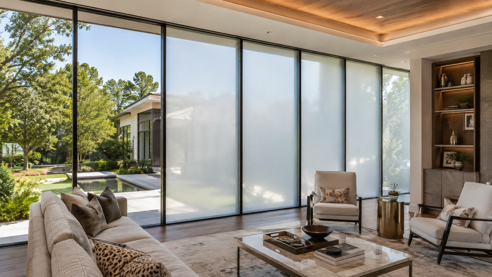 Switchable smart film on floor-to-ceiling windows in a Baton Rouge luxury home.