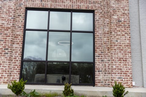 Commercial window tinting on a brick business property in Milwaukee
